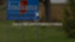 Photograph of Indiana welcome sign with text overlay "How to Sell Land & Property in Indiana"