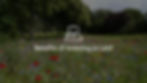Photograph of a field with text overlay "The Benefits of Land and Property Investment"