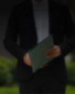 Photograph of a real estate agent holding a folder