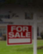 Photograph of a home for sale sign